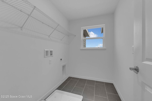 3155 Viridian Cir, Melbourne, FL 32904 - laundry area with washer hookup, hookup for an electric dryer, laundry area, dark tile patterned floors, and baseboards