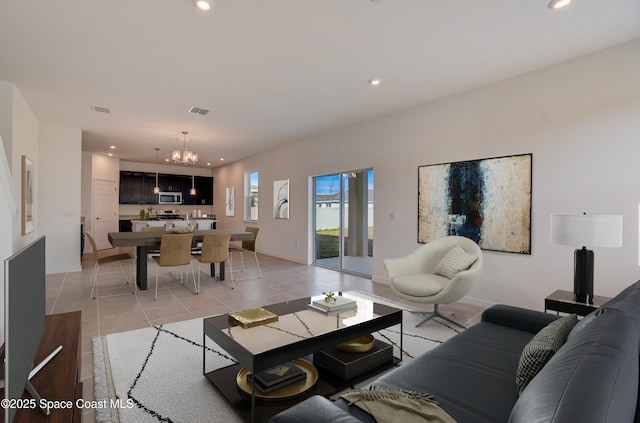 3155 Viridian Cir, Melbourne, FL 32904 - living room with recessed lighting, light tile patterned floors, and a chandelier