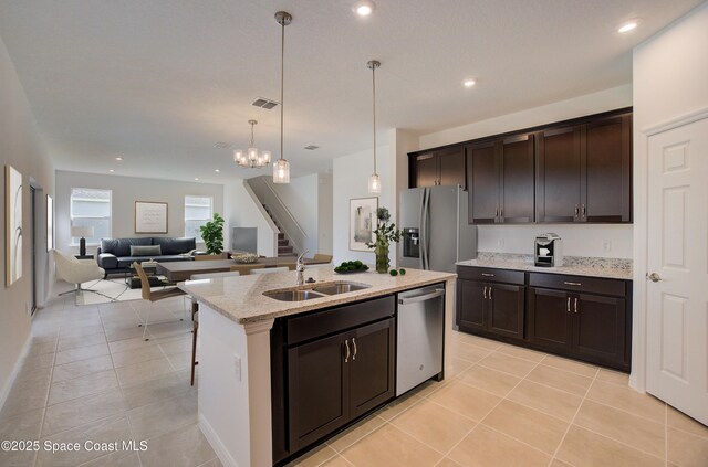 3155 Viridian Cir, Melbourne, FL 32904 - kitchen with a sink, dark brown cabinets, appliances with stainless steel finishes, and visible vents