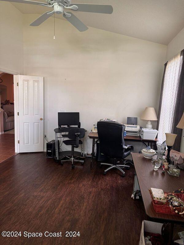 office with high vaulted ceiling, ceiling fan, and wood finished floors