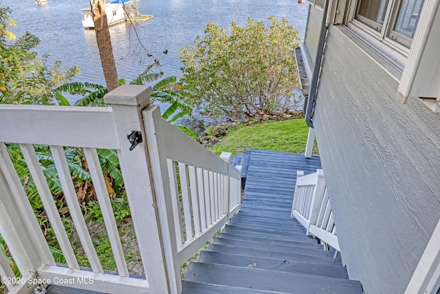 staircase with a water view