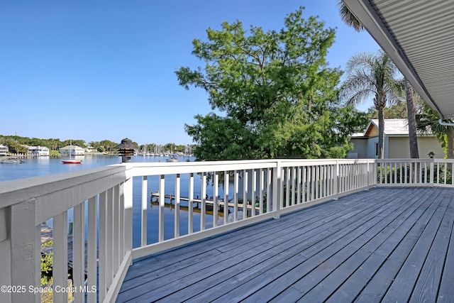 wooden deck with a water view