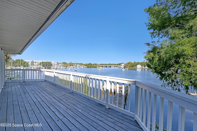 deck featuring a water view