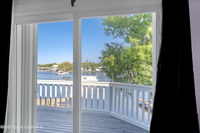 balcony featuring a water view