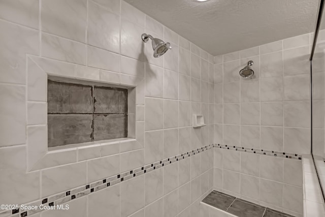 bathroom featuring a tile shower