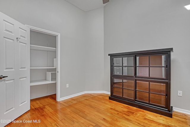unfurnished bedroom with light wood-style floors and baseboards