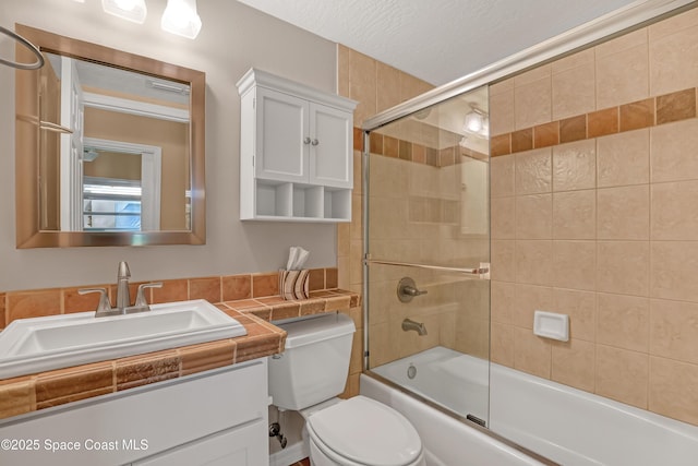 full bath featuring enclosed tub / shower combo, vanity, and toilet