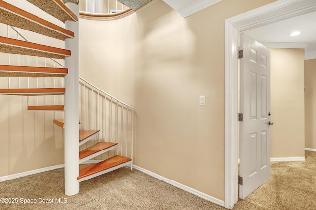 staircase featuring carpet floors, baseboards, recessed lighting, and ornamental molding