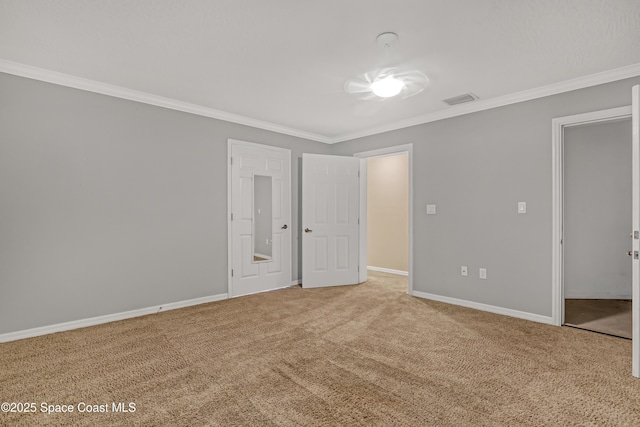 unfurnished bedroom featuring ornamental molding, carpet floors, and baseboards