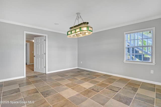 empty room with ornamental molding, baseboards, and tile patterned floors