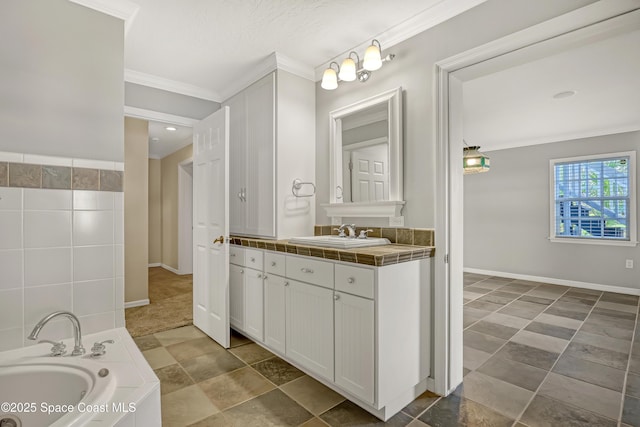 full bathroom featuring ornamental molding, a bath, vanity, and baseboards