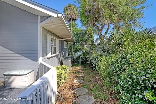 view of property exterior with central AC unit