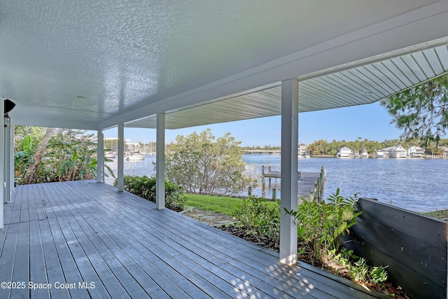 deck featuring a water view and a dock