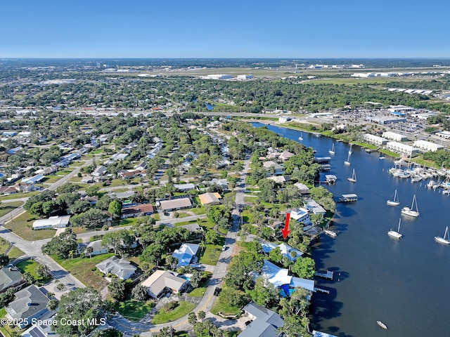 aerial view of property's location featuring a large body of water