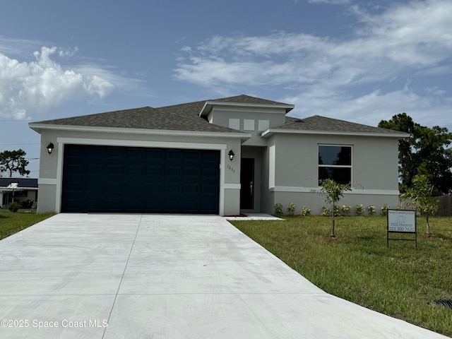 1631 Palatka Rd SE Unit 16, Palm Bay, FL 32909 - prairie-style house with an attached garage, concrete driveway, a front yard, and stucco siding