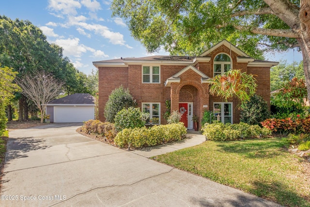 view of front of house with brick siding, a front yard, and a garage