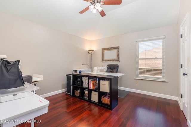 home office featuring baseboards, ceiling fan, wood finished floors, and lofted ceiling