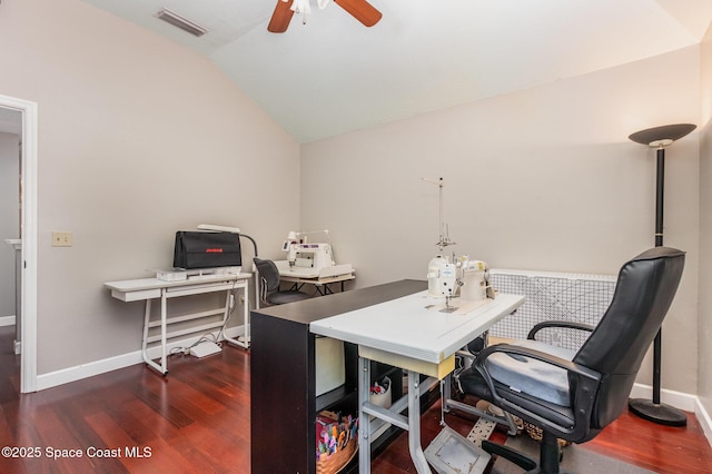 office area featuring a ceiling fan, visible vents, vaulted ceiling, wood finished floors, and baseboards