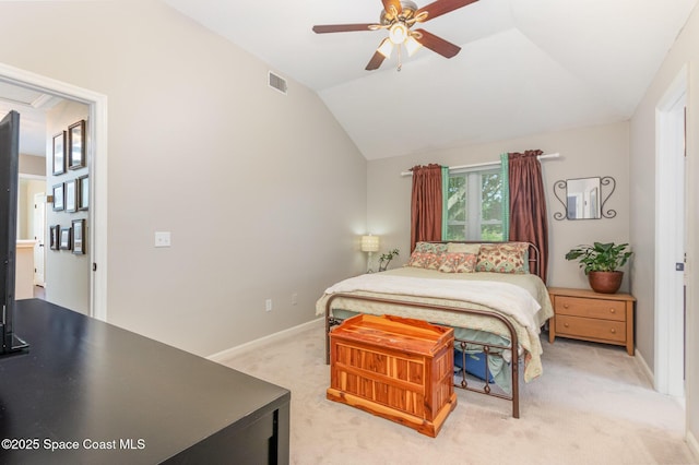 bedroom featuring baseboards, visible vents, light carpet, and lofted ceiling