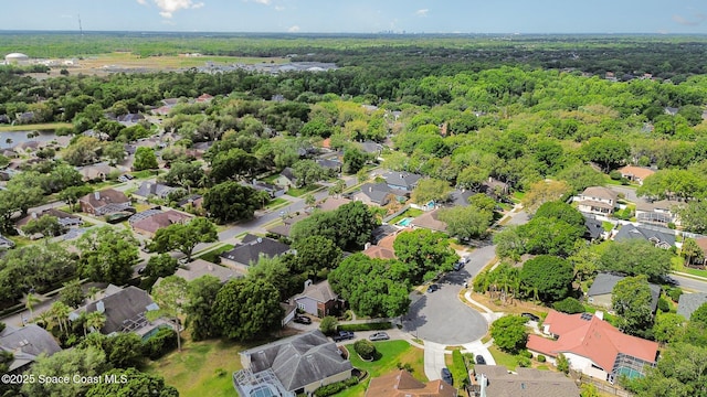 aerial view with a residential view and a view of trees