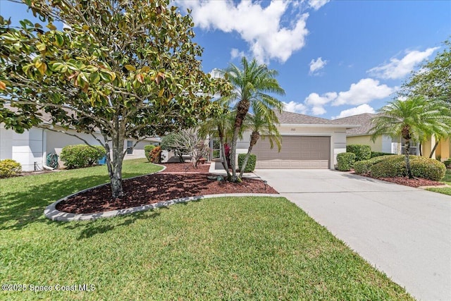 view of front of home featuring a front lawn, driveway, stucco siding, and an attached garage