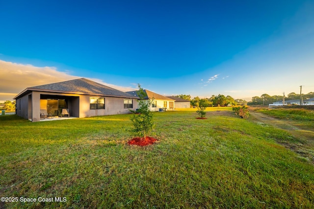 487 Old Country Rd SE, Palm Bay, FL 32909 - view of yard at dusk