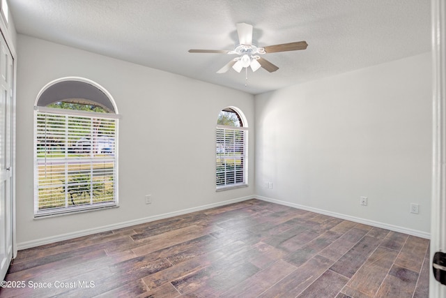 5215 Pina Vista Dr, Melbourne, FL 32934 - unfurnished room featuring wood finished floors, ceiling fan, baseboards, and a textured ceiling