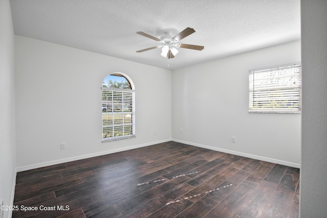 5215 Pina Vista Dr, Melbourne, FL 32934 - spare room featuring wood-type flooring, a ceiling fan, baseboards, and a textured ceiling