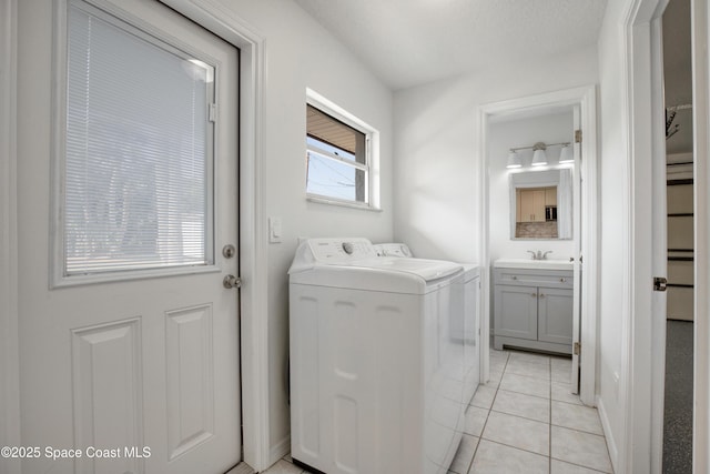 5215 Pina Vista Dr, Melbourne, FL 32934 - laundry room with washer and dryer and light tile patterned floors