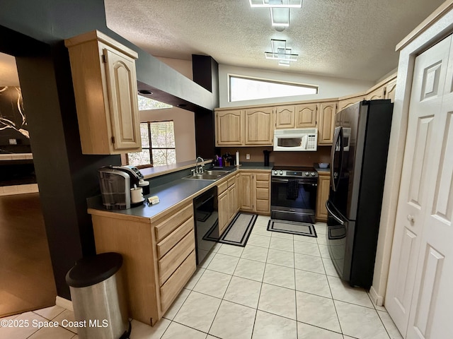kitchen with range with electric cooktop, dishwasher, light brown cabinets, freestanding refrigerator, and white microwave