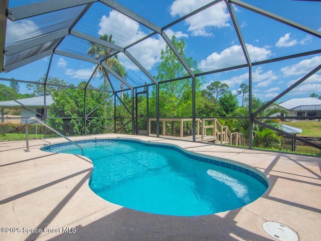 344 Concha Dr, Sebastian, FL 32958 - pool with glass enclosure and a patio