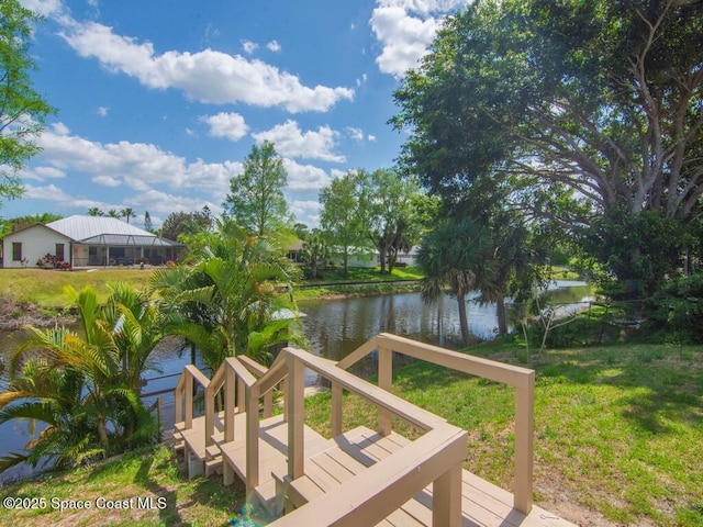 344 Concha Dr, Sebastian, FL 32958 - view of dock with a water view and a lawn