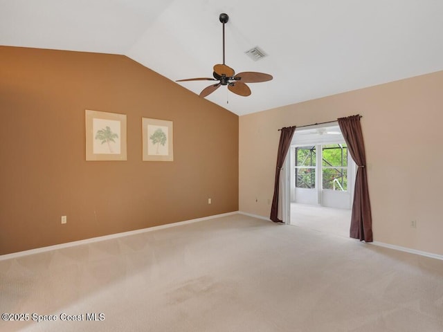 344 Concha Dr, Sebastian, FL 32958 - empty room with light carpet, ceiling fan, baseboards, and lofted ceiling