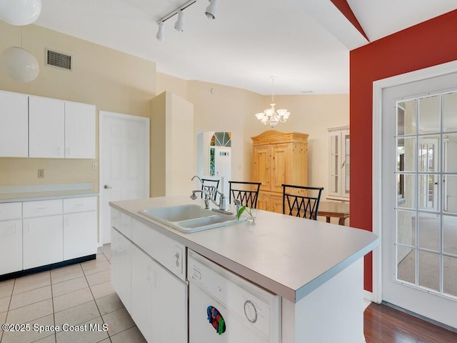 344 Concha Dr, Sebastian, FL 32958 - kitchen with a sink, visible vents, light countertops, and dishwasher
