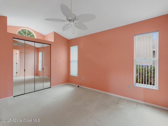 344 Concha Dr, Sebastian, FL 32958 - unfurnished bedroom with baseboards, vaulted ceiling, and carpet floors