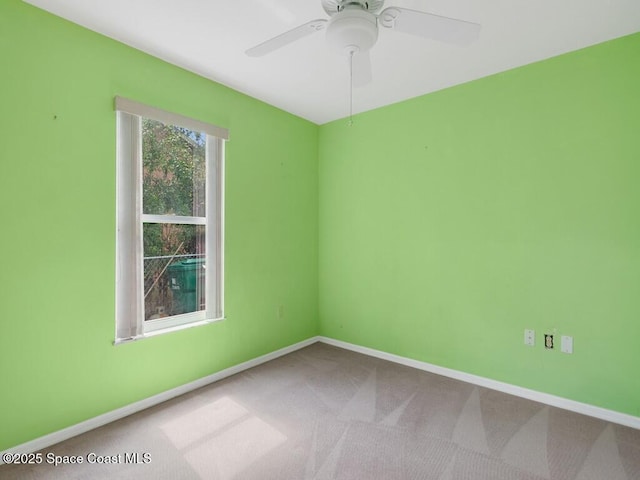 344 Concha Dr, Sebastian, FL 32958 - unfurnished room featuring baseboards, a ceiling fan, and carpet floors
