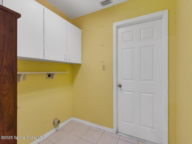 344 Concha Dr, Sebastian, FL 32958 - laundry room featuring hookup for an electric dryer, baseboards, light tile patterned floors, visible vents, and cabinet space