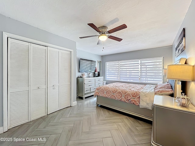 1760 Tee Dee Ln, Titusville, FL 32780 - bedroom featuring a closet, ceiling fan, and a textured ceiling