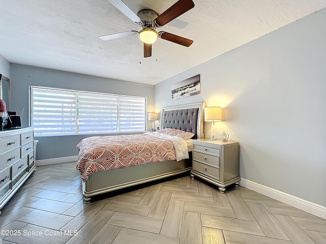 1760 Tee Dee Ln, Titusville, FL 32780 - bedroom with baseboards, a textured ceiling, and ceiling fan