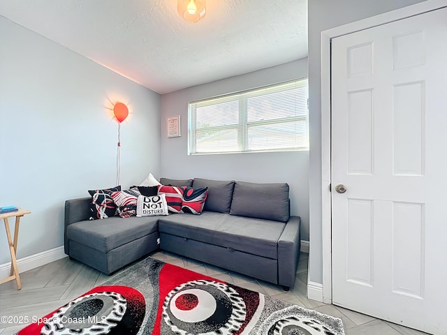 1760 Tee Dee Ln, Titusville, FL 32780 - living room with light tile patterned floors, baseboards, lofted ceiling, and a textured ceiling