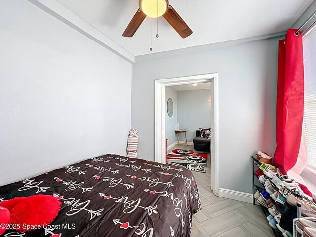 1760 Tee Dee Ln, Titusville, FL 32780 - bedroom featuring baseboards and a ceiling fan