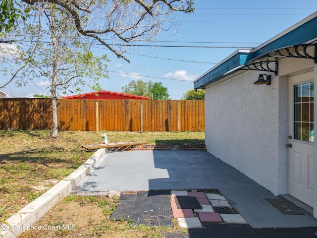 1760 Tee Dee Ln, Titusville, FL 32780 - view of yard featuring a fenced backyard and a patio