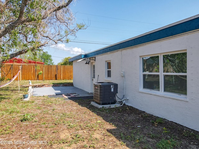 1760 Tee Dee Ln, Titusville, FL 32780 - view of yard featuring fence, cooling unit, and a patio area