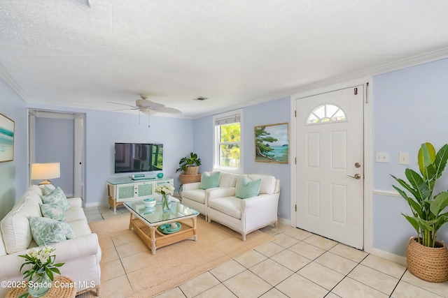 living area featuring light tile patterned flooring, visible vents, baseboards, ornamental molding, and ceiling fan