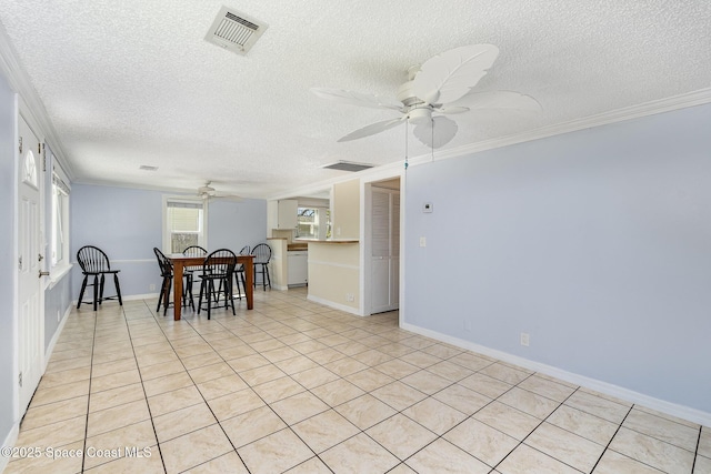 dining space featuring a ceiling fan, crown molding, baseboards, and visible vents