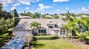 2702 Barrow Dr, Merritt Island, FL 32952 - view of front facade with driveway and a garage