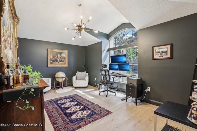 2702 Barrow Dr, Merritt Island, FL 32952 - office area with baseboards, vaulted ceiling, an inviting chandelier, and wood finished floors