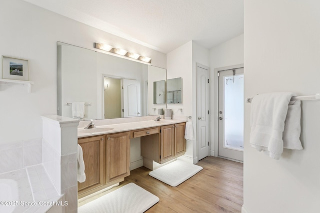 2702 Barrow Dr, Merritt Island, FL 32952 - full bath featuring double vanity, a sink, and wood finished floors