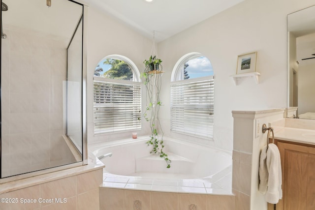 2702 Barrow Dr, Merritt Island, FL 32952 - full bath with a bath, vanity, vaulted ceiling, and tiled shower