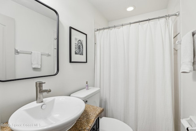 2702 Barrow Dr, Merritt Island, FL 32952 - full bath with a shower with curtain, toilet, a sink, and recessed lighting